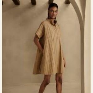 Khaki and black pinstripe swing dress with pockets.